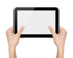 weibliche Hände halten und berühren auf Tablet-PC foto