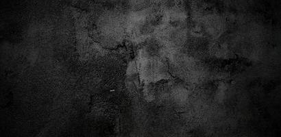 dunkelgrauer schwarzer Zement für den Hintergrund. schwarzer stein beton textur hintergrund foto