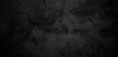 beängstigende Wand aus schwarzem Stein Beton Textur Hintergrund, dunkelgraue schwarze Horrorzement Textur für den Hintergrund foto