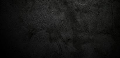 beängstigende Wand aus schwarzem Stein Beton Textur Hintergrund, dunkelgraue schwarze Horrorzement Textur für den Hintergrund foto