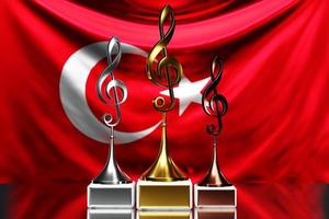 Treble Clef Awards für den Gewinn des Musikpreises vor dem Hintergrund der Nationalflagge der Türkei, 3D-Illustration. foto