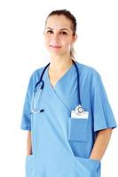 Doktorfrau stehend, lokalisiert auf weißem Hintergrund foto