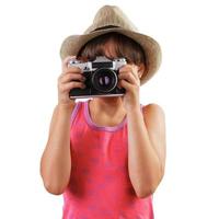 Mädchen mit einer Filmkamera in den Händen von foto