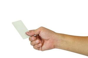 Hand, die eine leere weiße Kreditkarte isoliert auf weißem Hintergrund hält, Kunststoff-Debitkarte, Beschneidungspfad enthalten foto