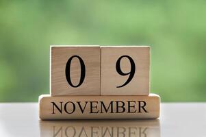 9. november kalenderdatumstext auf holzblöcken mit kopierraum für ideen oder text. Platz kopieren foto