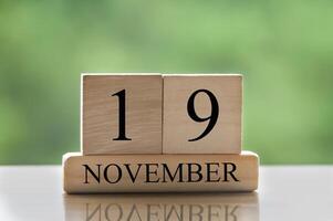 19. november kalenderdatumstext auf holzblöcken mit kopierraum für ideen oder text. Platz kopieren foto