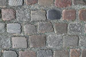 Detaillierte Nahaufnahme auf alten historischen Kopfsteinpflasterstraßen und Gehwegen foto