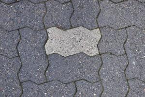 Detaillierte Nahaufnahme auf alten historischen Kopfsteinpflasterstraßen und Gehwegen foto