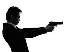 asiatische Schützenkiller-Porträt-Schießschattenbild foto