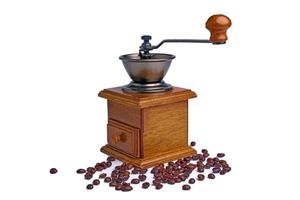 vintage kaffeemühle. alte retro handbetriebene kaffeemühle aus holz und metall. manuelle kaffeemühle zum mahlen von kaffeebohnen. isoliert auf weißem Hintergrund. foto