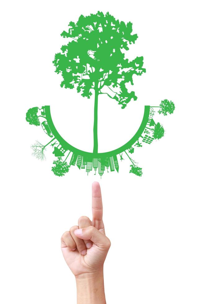 grönt koncept. träd på jorden i handen foto