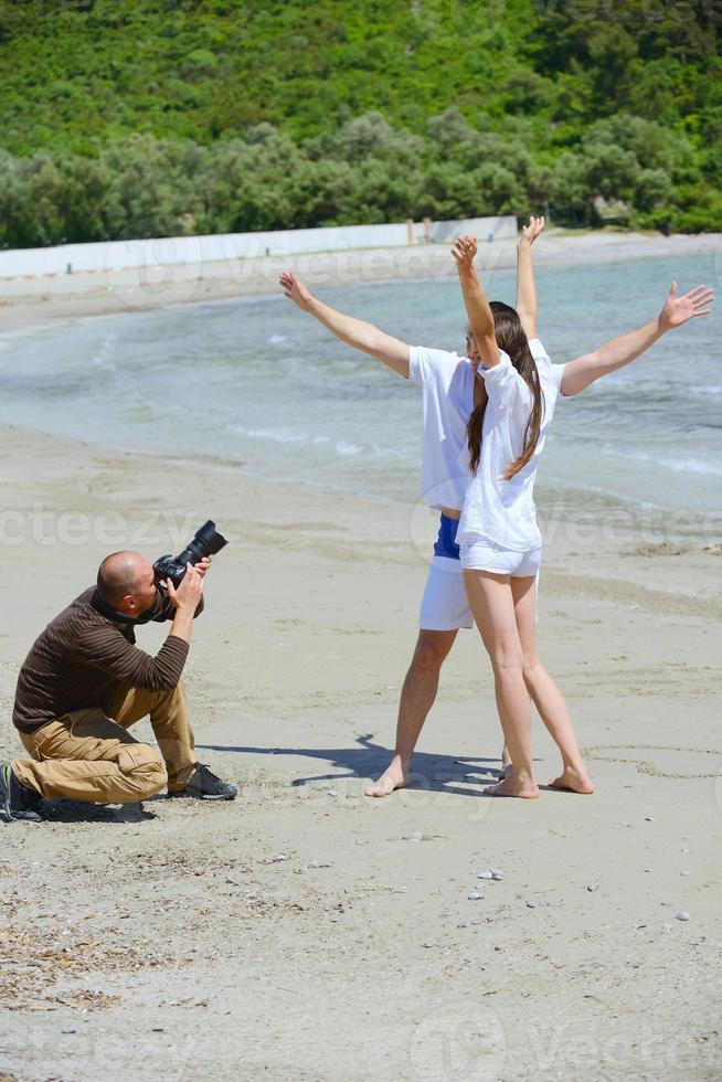 fotograf tar Foto på strand