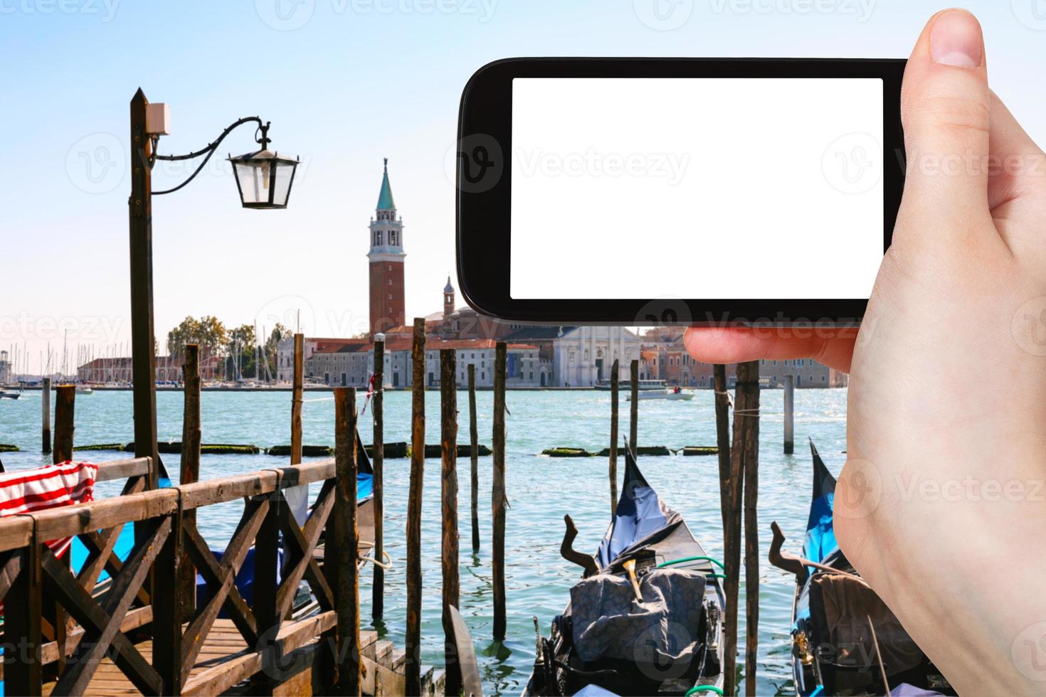 turist fotografier gondoler i Venedig stad foto