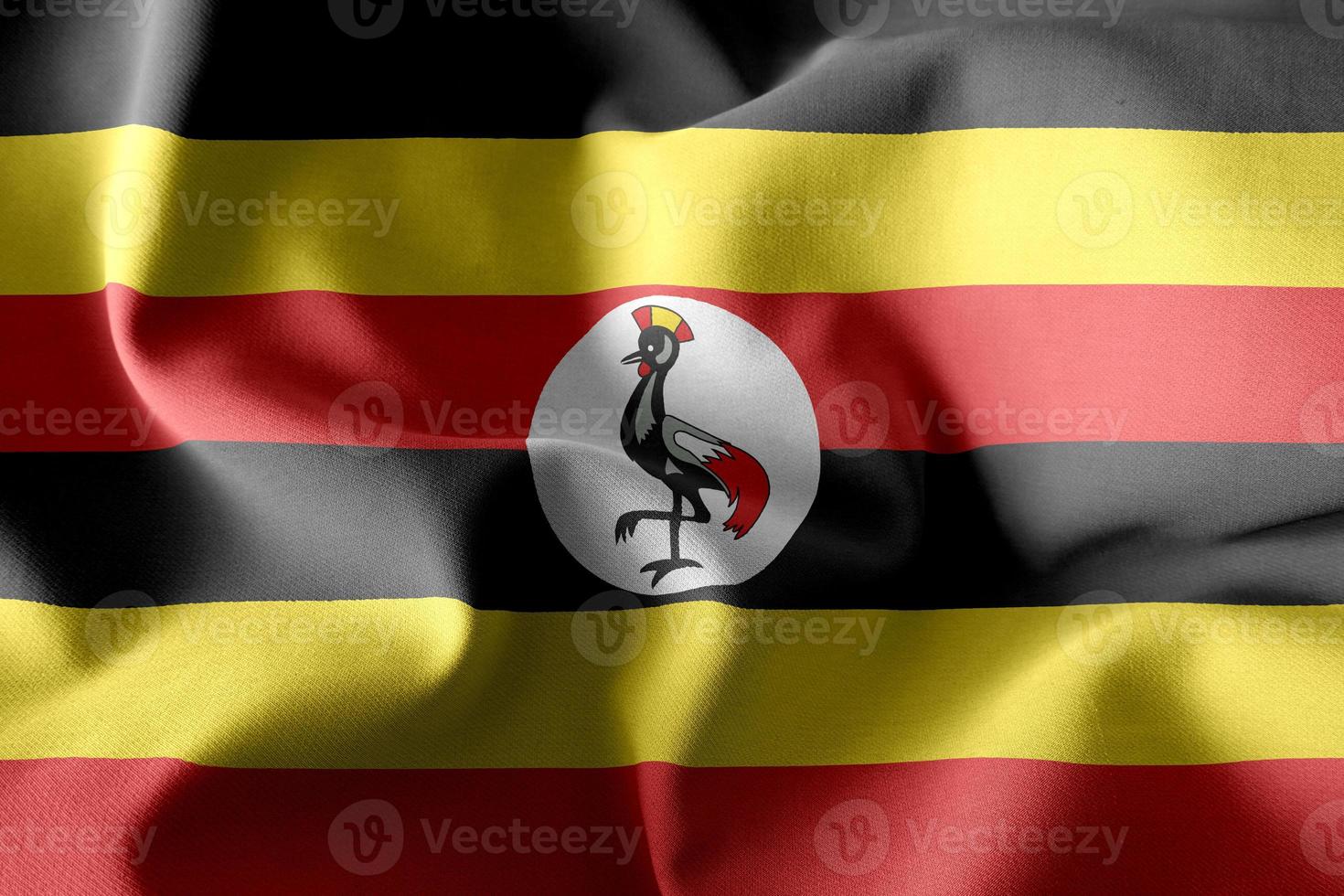 3d realistisk vinka silke flagga av uganda foto