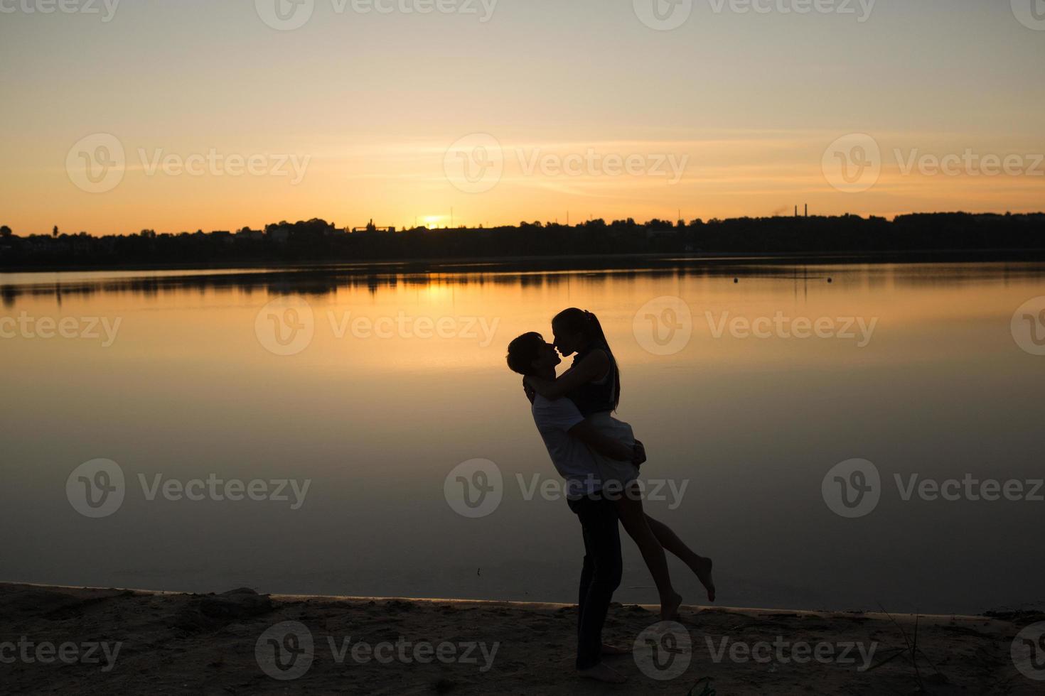 par i soluppgång på de strand foto