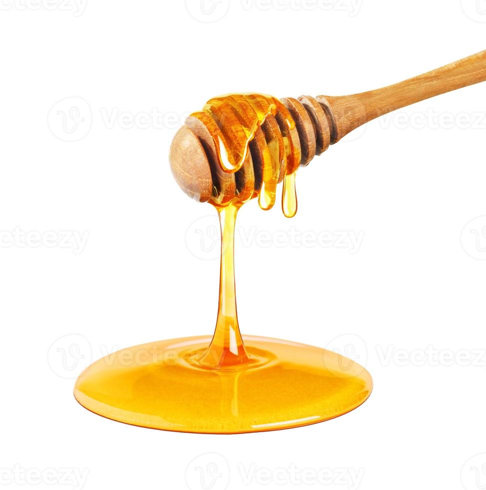 honung droppande isolerat på en vit bakgrund, droppade honung, honung dipper foto