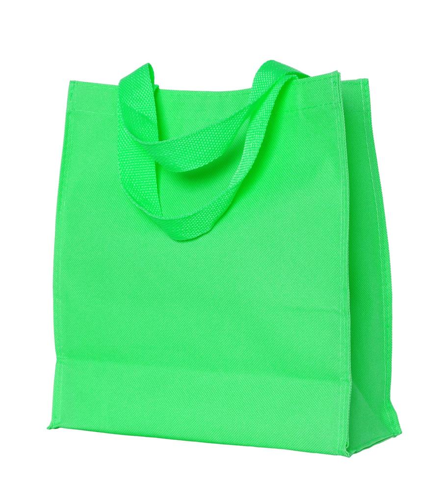 grön bomull väska isolerat på vit med klippning väg foto