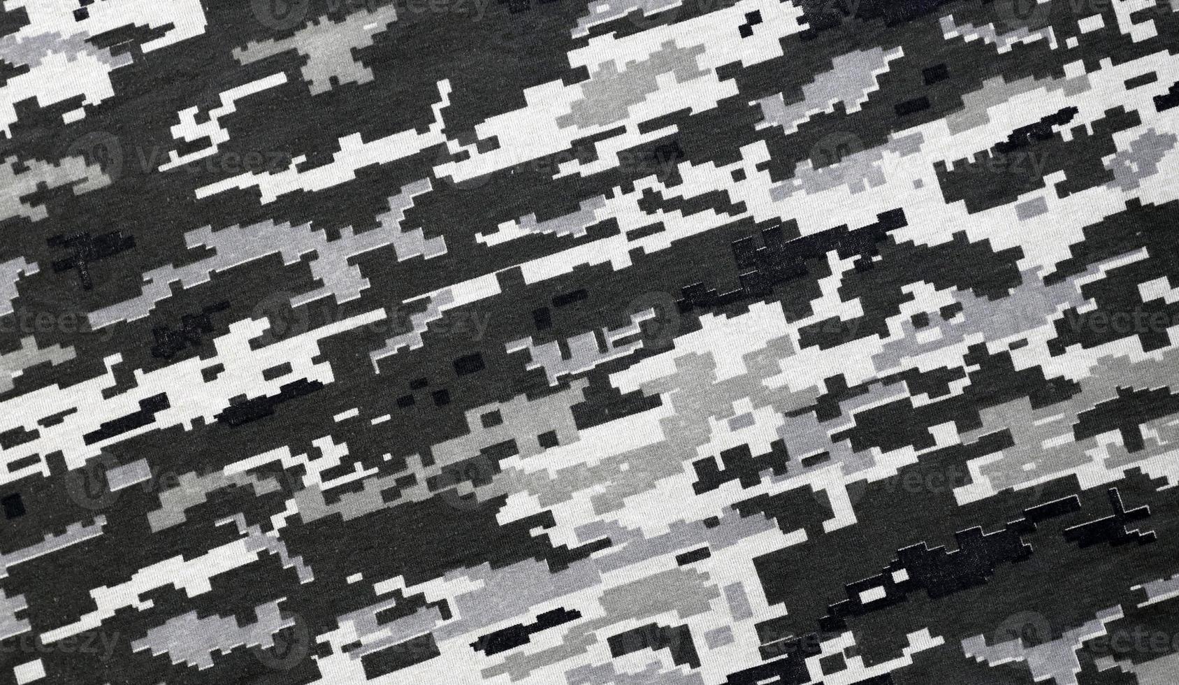 tyg med textur av ukrainska militär pixeled kamouflage. trasa med camo mönster i grå, brun och grön pixel former. officiell enhetlig av ukrainska soldater foto