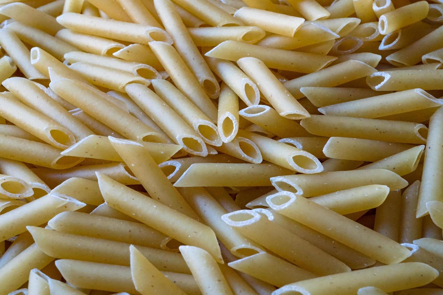 okokt makaroner pasta bakgrund, italiensk mat foto