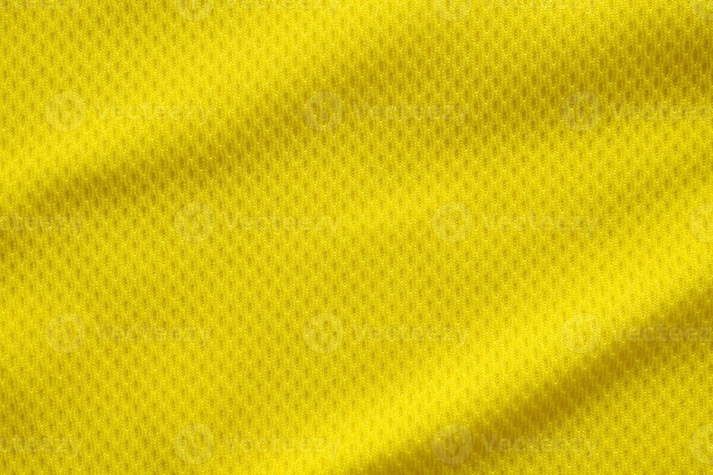 gul färg fotbollströja kläder tyg textur sportkläder bakgrund, närbild foto