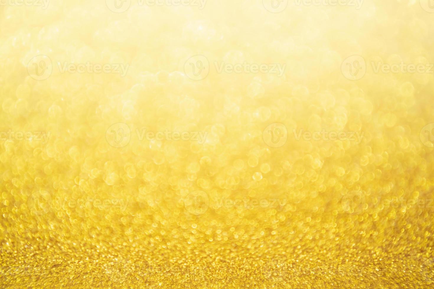 abstrakt guld glitter festlig jul textur bakgrund oskärpa med bokeh ljus foto