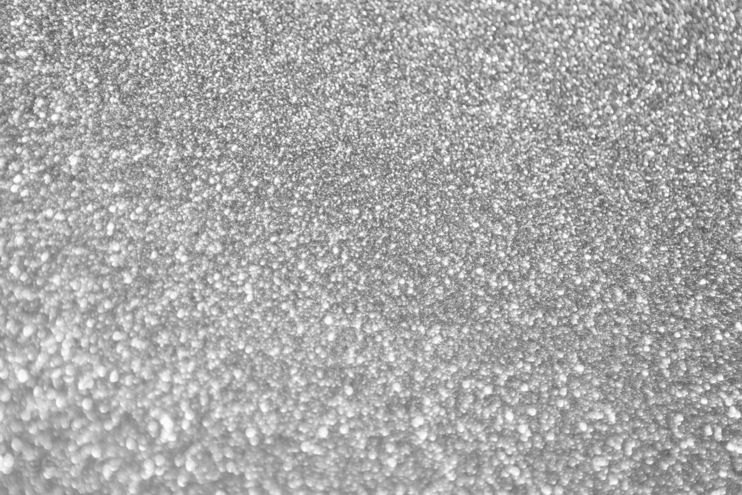 abstrakt fläck silver- glitter gnistra defocused bokeh ljus bakgrund foto