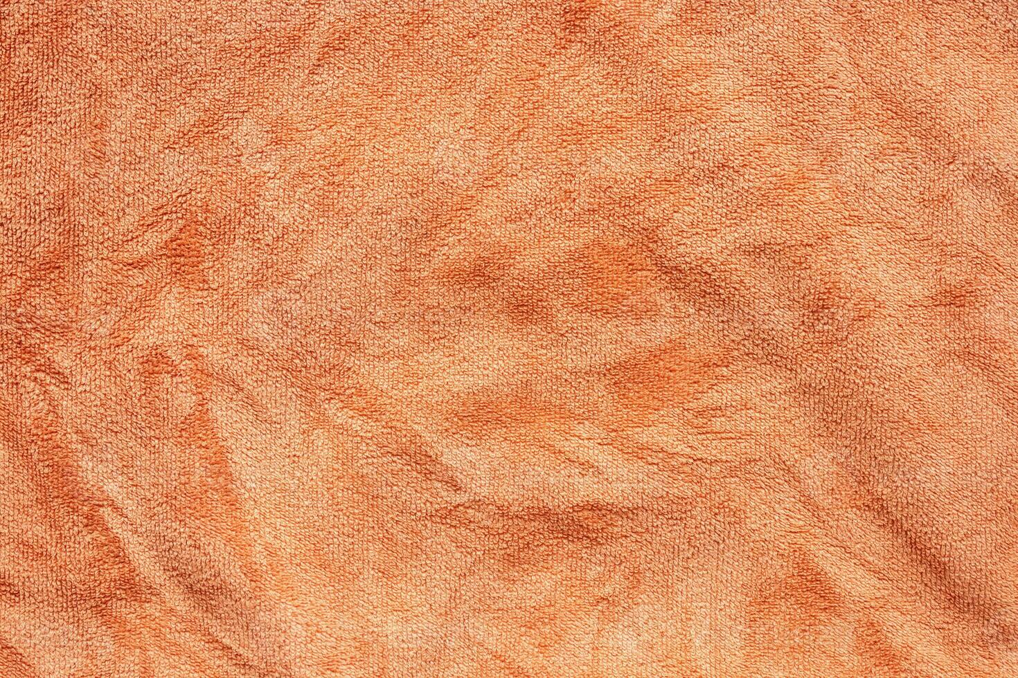 orange handduk tyg textur yta stänga upp bakgrund foto