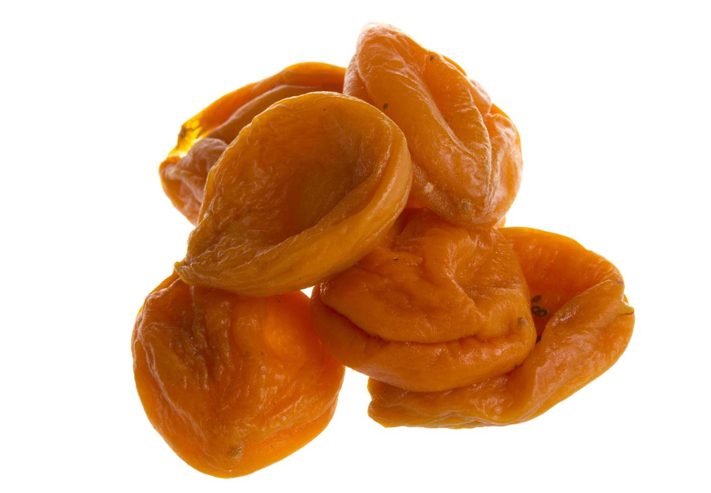 torkades aprikos på vit foto