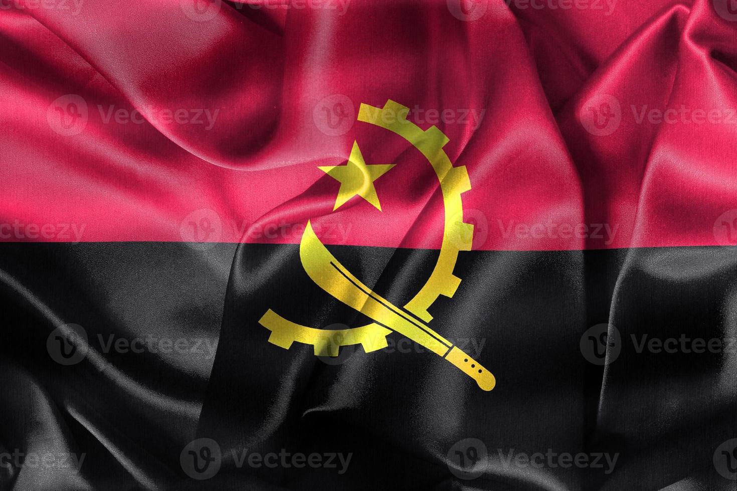 angola flagga - realistiskt viftande tygflagga foto