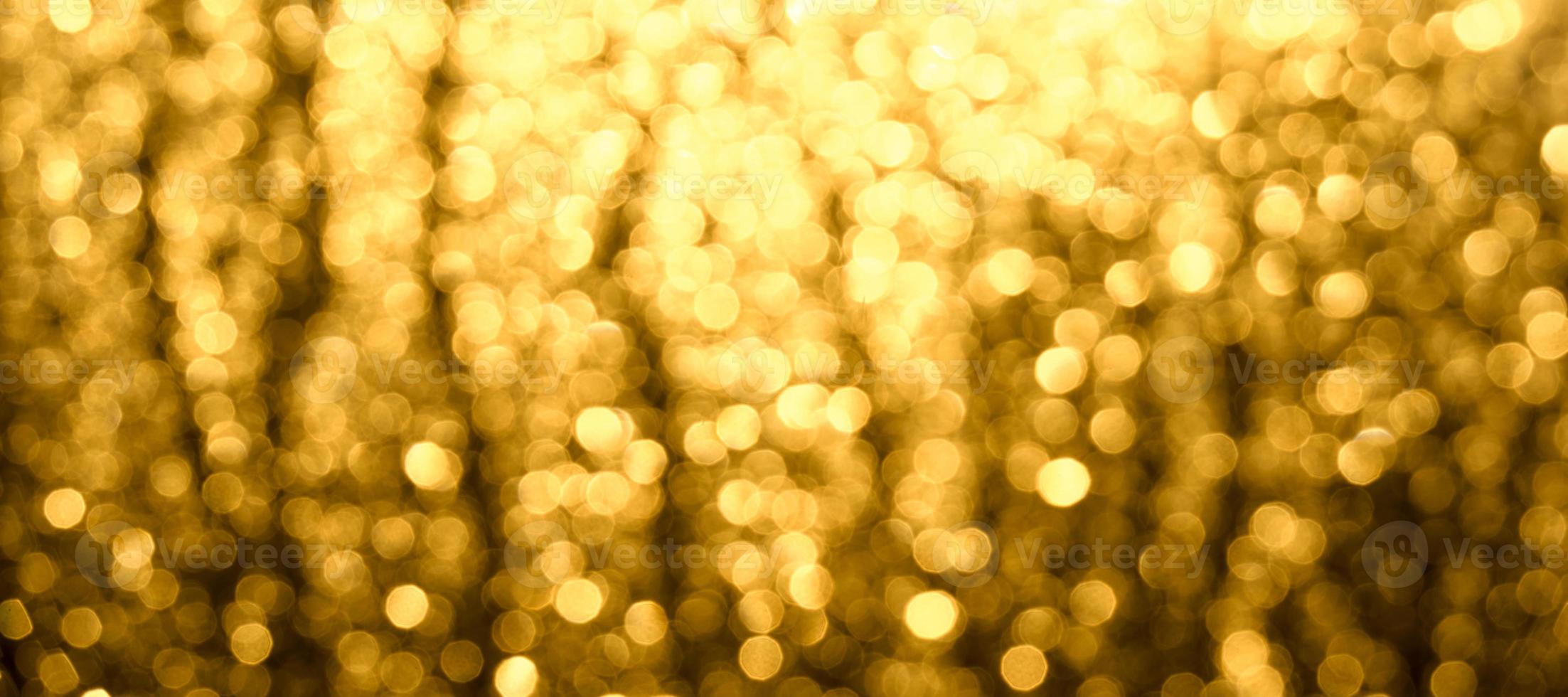 abstrakt jul suddig bakgrund. en gyllenbrun glöd av bokeh. foto