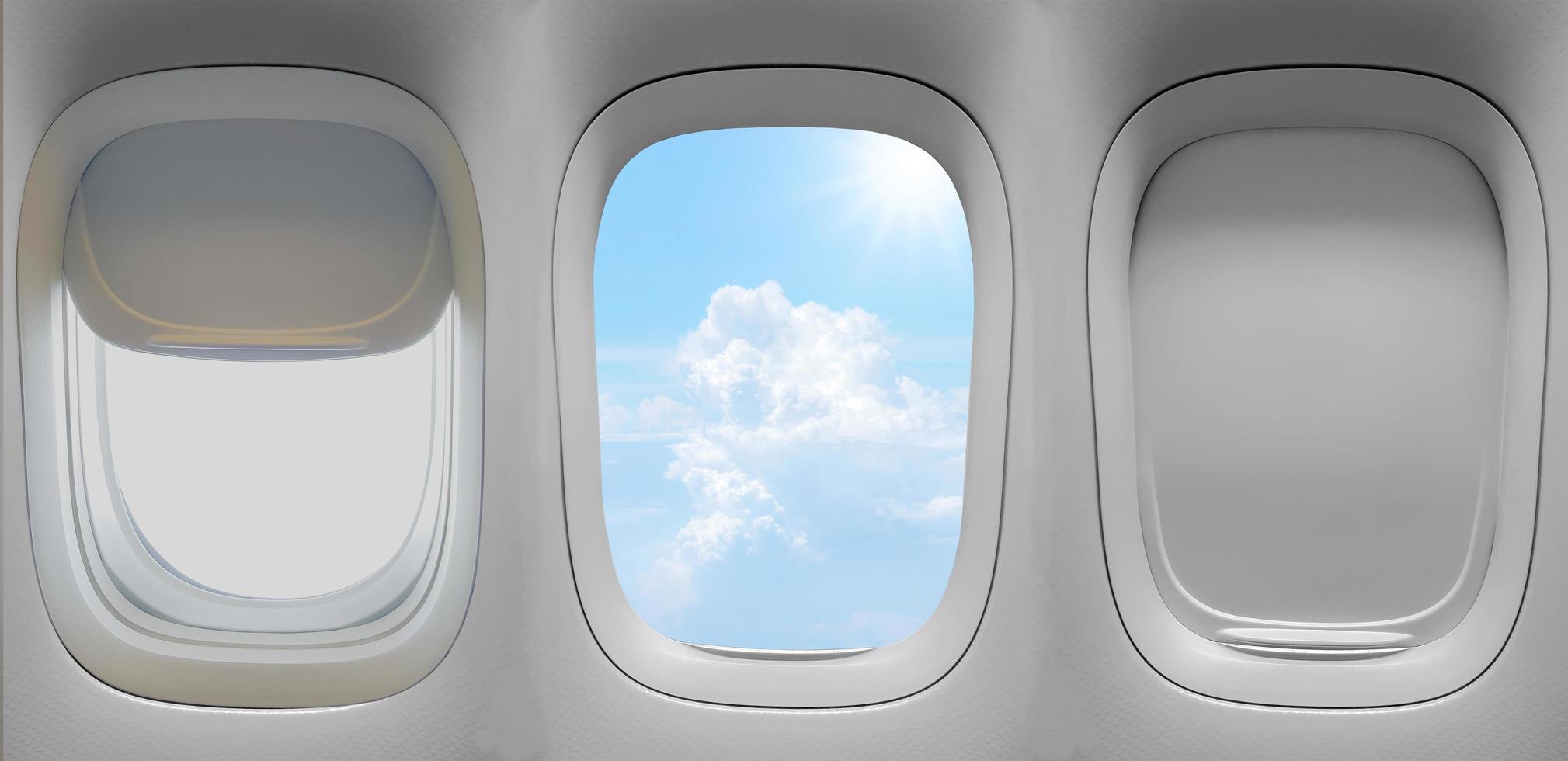 tre flygplansfönster foto