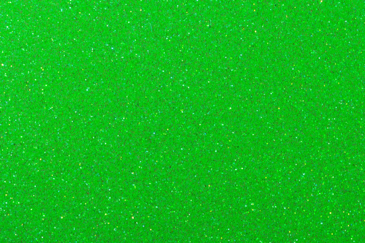 ljusgrön glitterpappersbakgrund foto