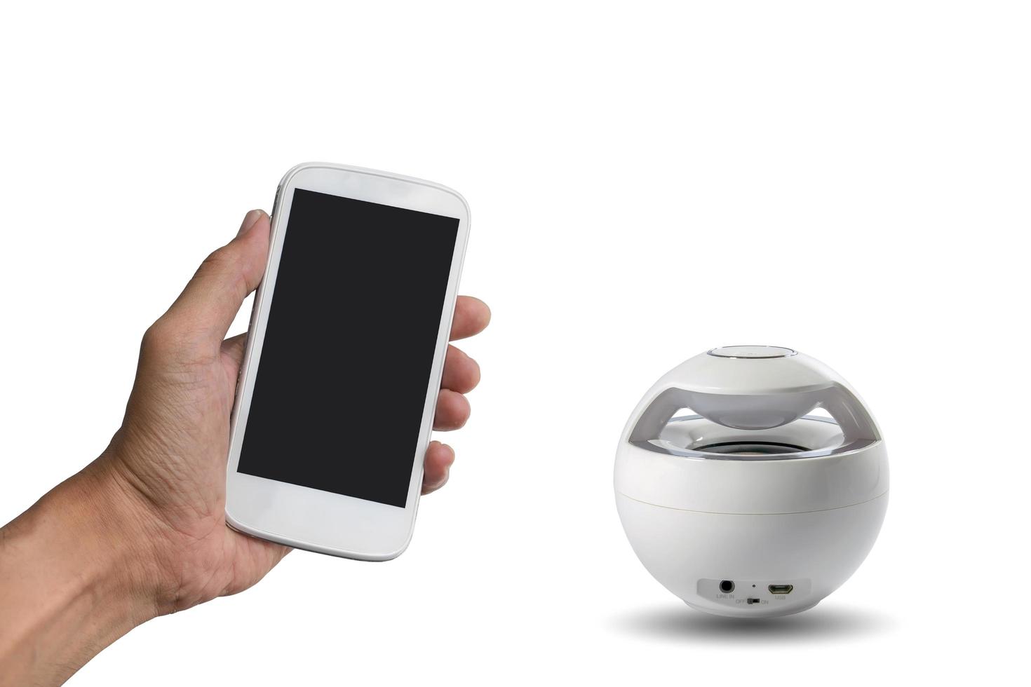 smart telefon och Bluetooth-högtalare foto