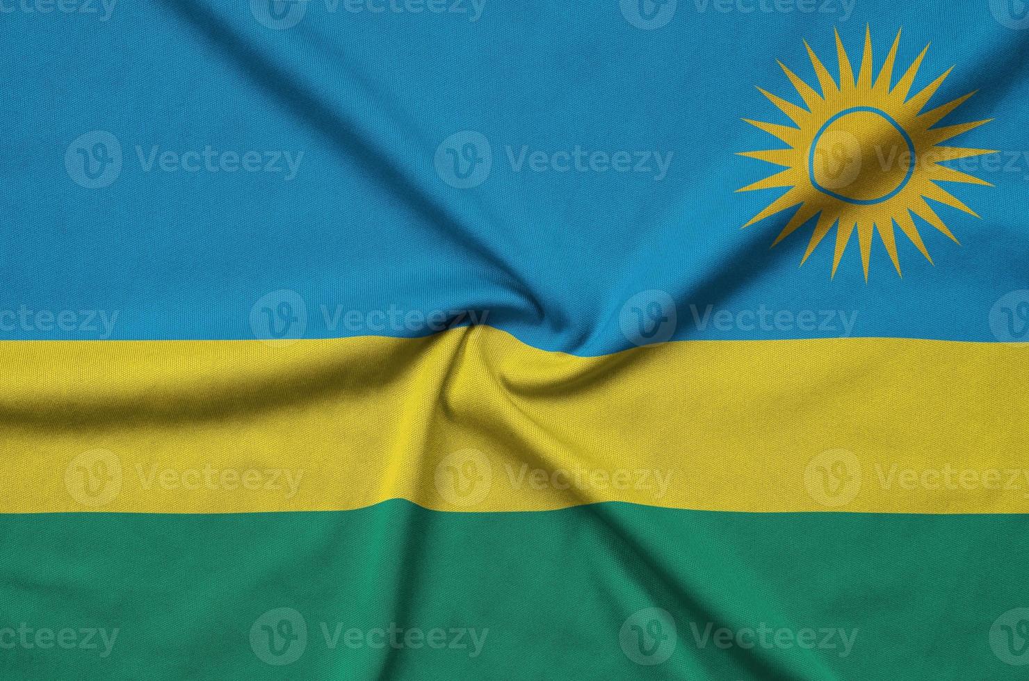 rwanda flagga är avbildad på en sporter trasa tyg med många veck. sport team baner foto