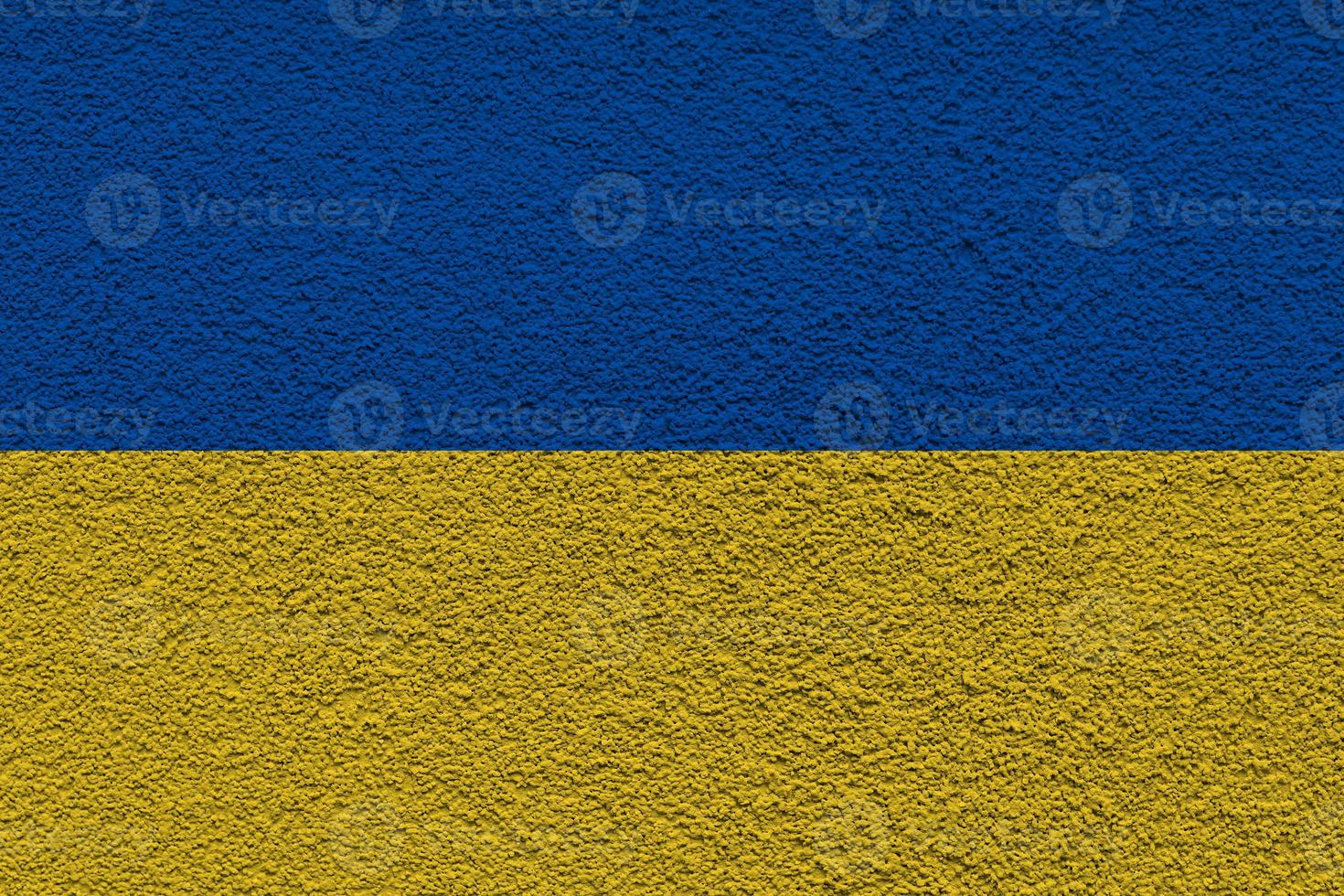 ukrainska statens nationella flagga. textur betong grunge vägg i gul-blå färg. statens symbol för Ukraina och ukrainare. ukrainska flaggan på en betongvägg bakgrund. foto