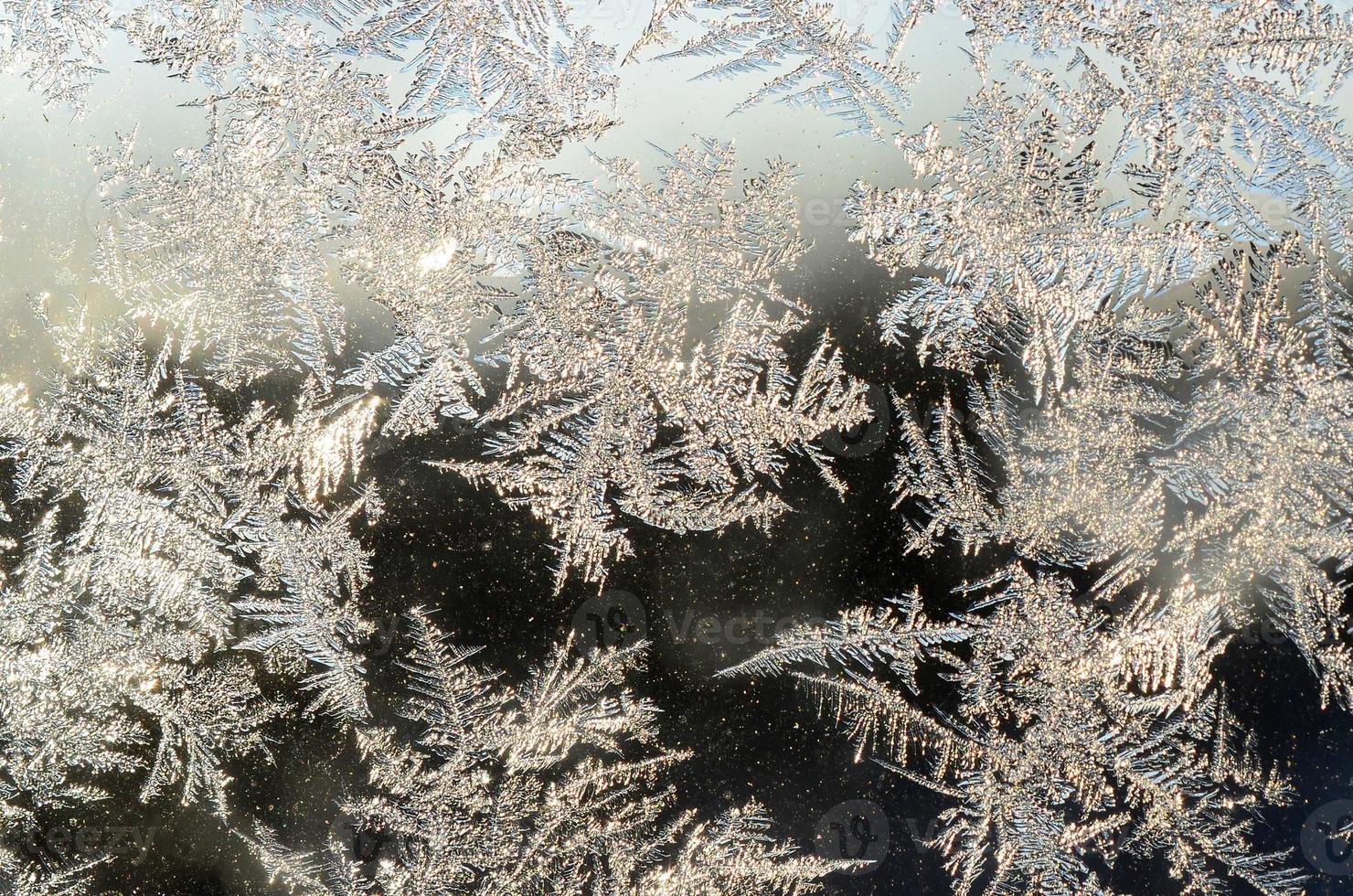 snöflingor frost rimfrost makro på fönster glas Ruta foto