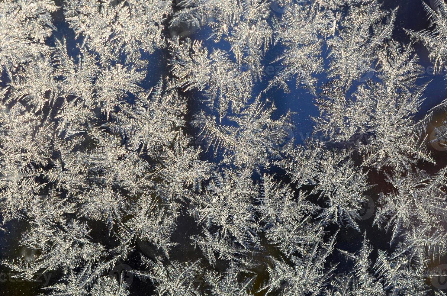 snöflingor frost rimfrost makro på fönster glas Ruta foto