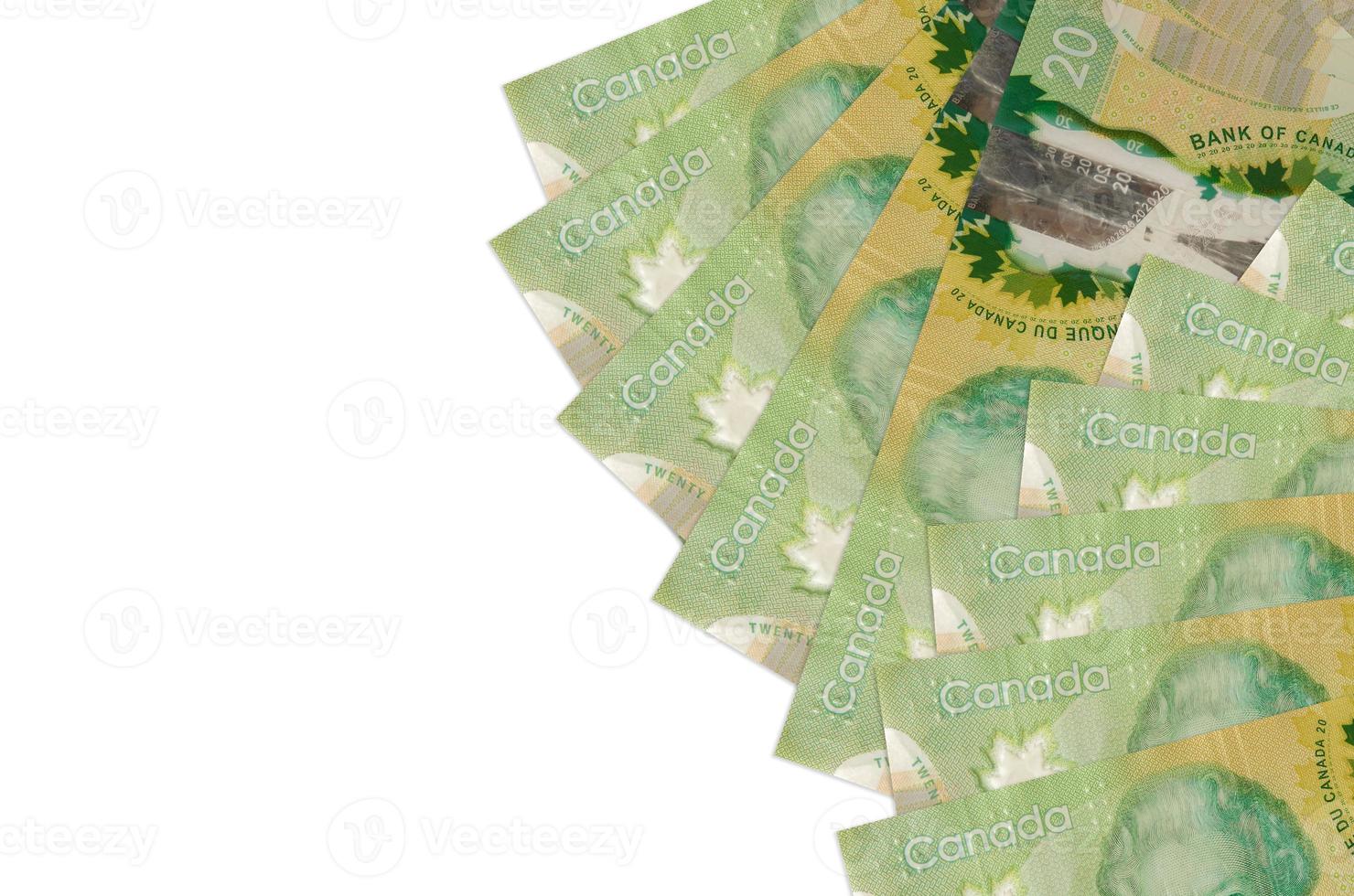 20 kanadensisk dollar räkningar lögner isolerat på vit bakgrund med kopia Plats. rik liv konceptuell bakgrund foto