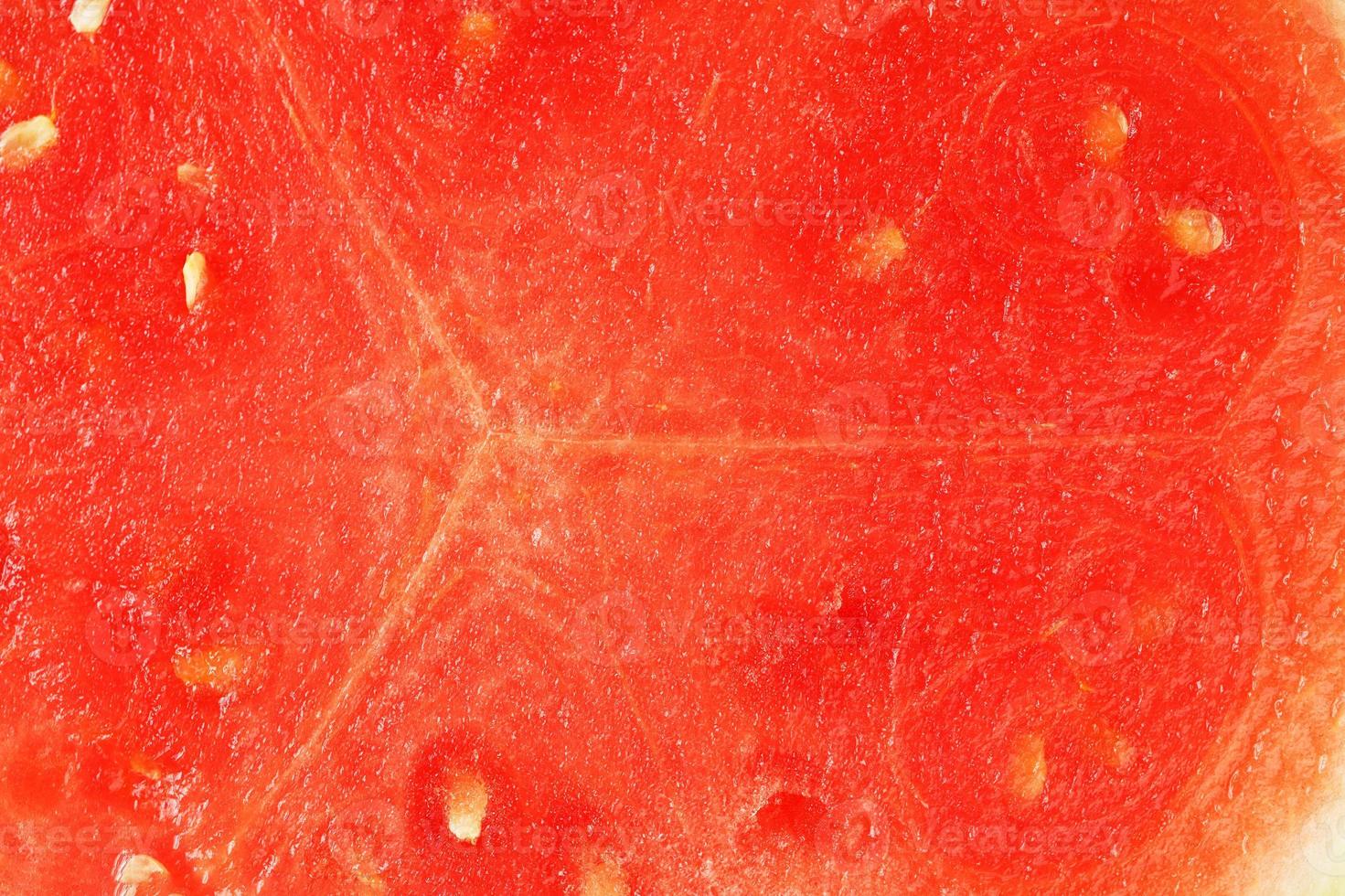 de textur av de saftig massa av röd vattenmelon närbild, full skärm som en bakgrund foto