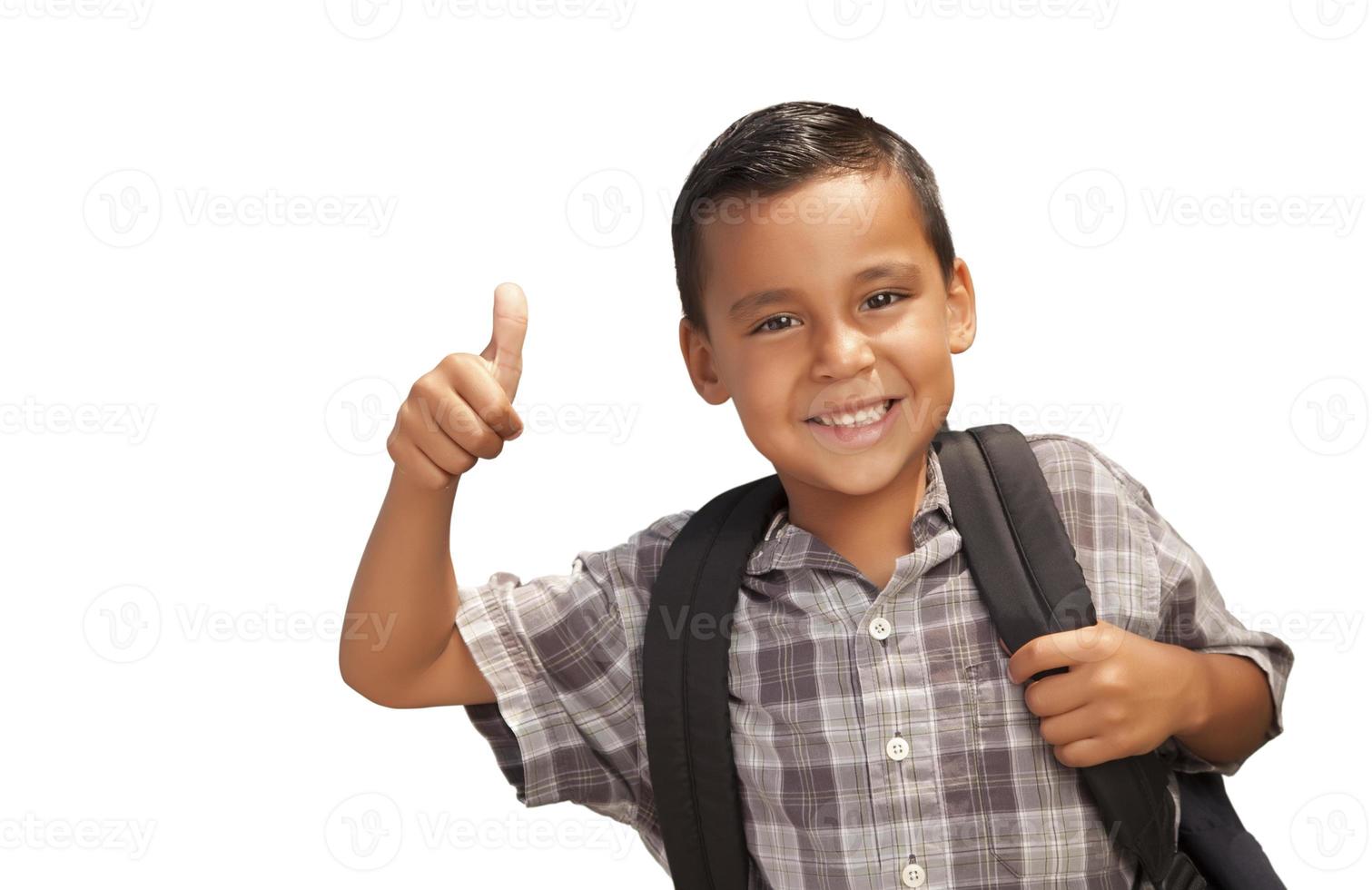 Lycklig ung latinamerikan skola pojke med tummen upp foto