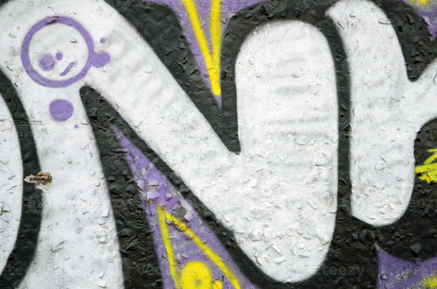 textur av en fragment av de vägg med graffiti målning, som är avbildad på Det. ett bild av en bit av graffiti teckning som en Foto på gata konst och graffiti kultur ämnen