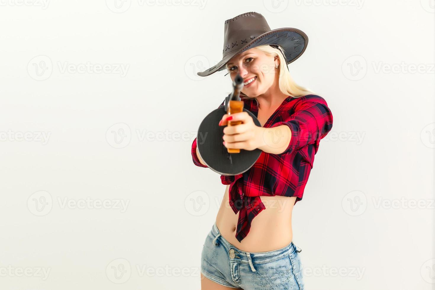 de sexig blond kvinna med en hatt kvinna cowboy på en vit bakgrund foto