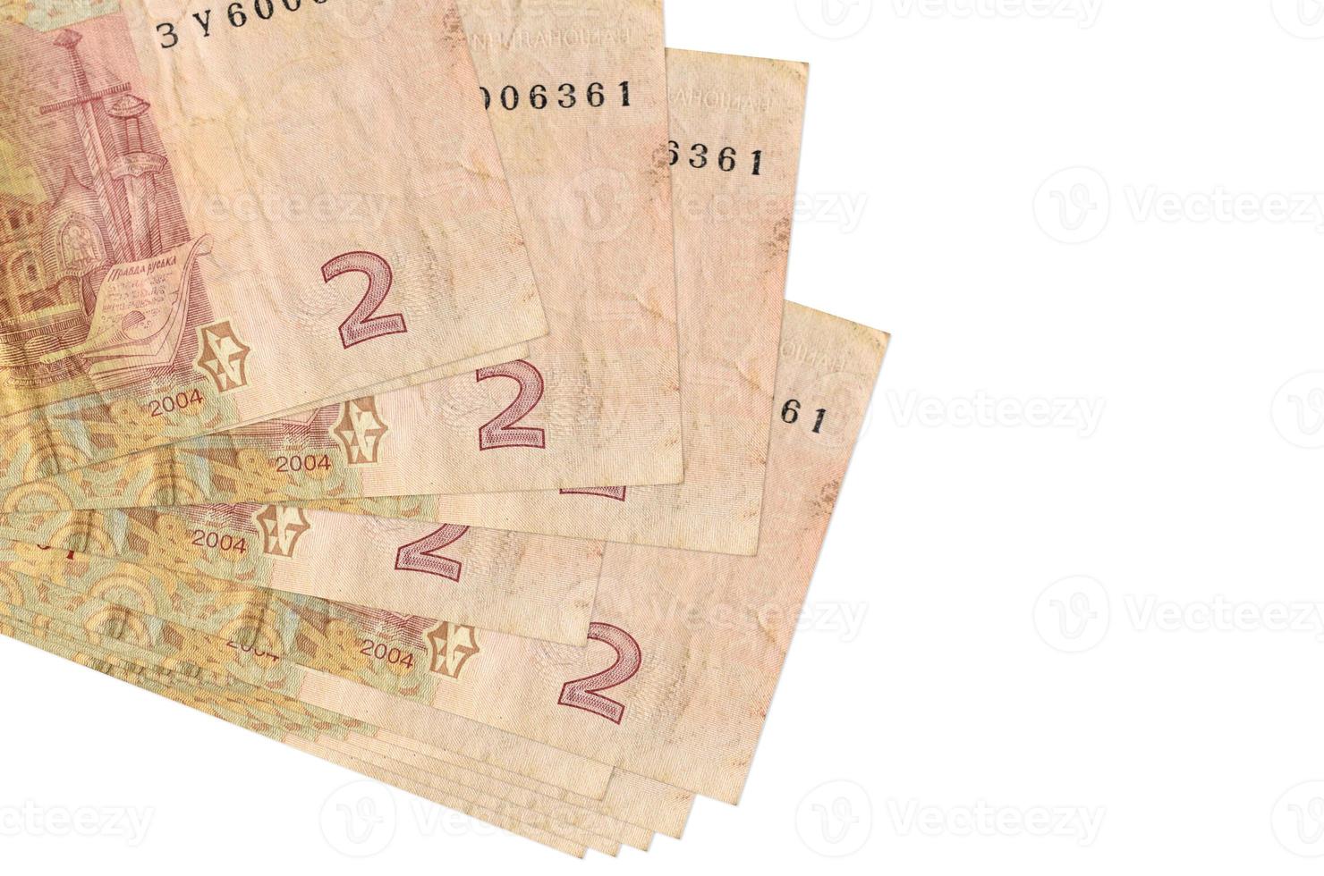 2 ukrainska hryvnias räkningar lögner i små knippa eller packa isolerat på vit. attrapp med kopia Plats. företag och valuta utbyta foto