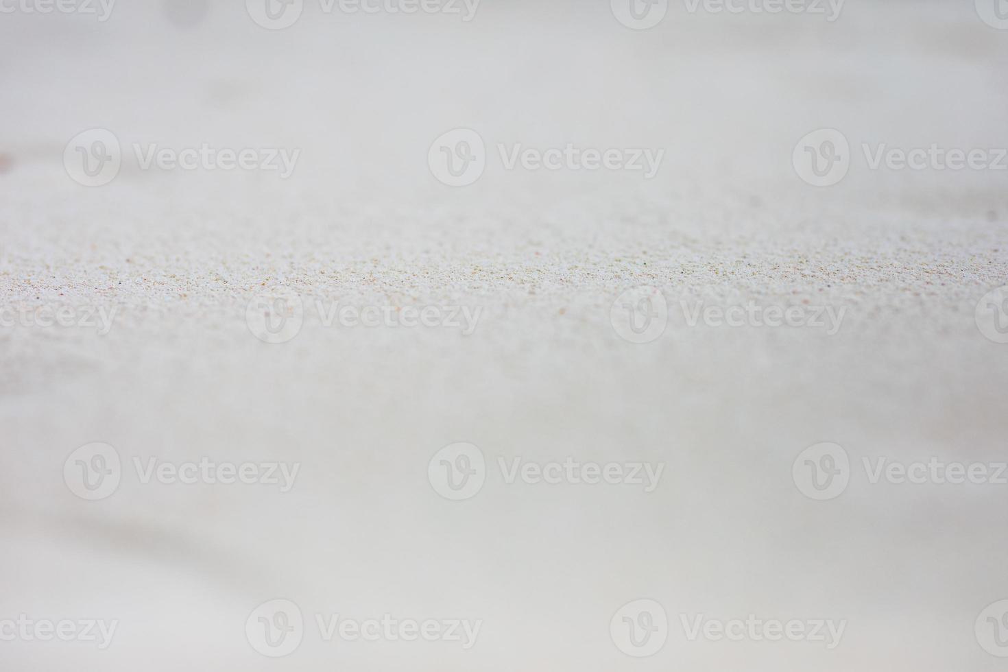 vit sand, abstrakt natur mönster. makro bild av mjuk sand på strand, exotisk närbild, yta av sand foto