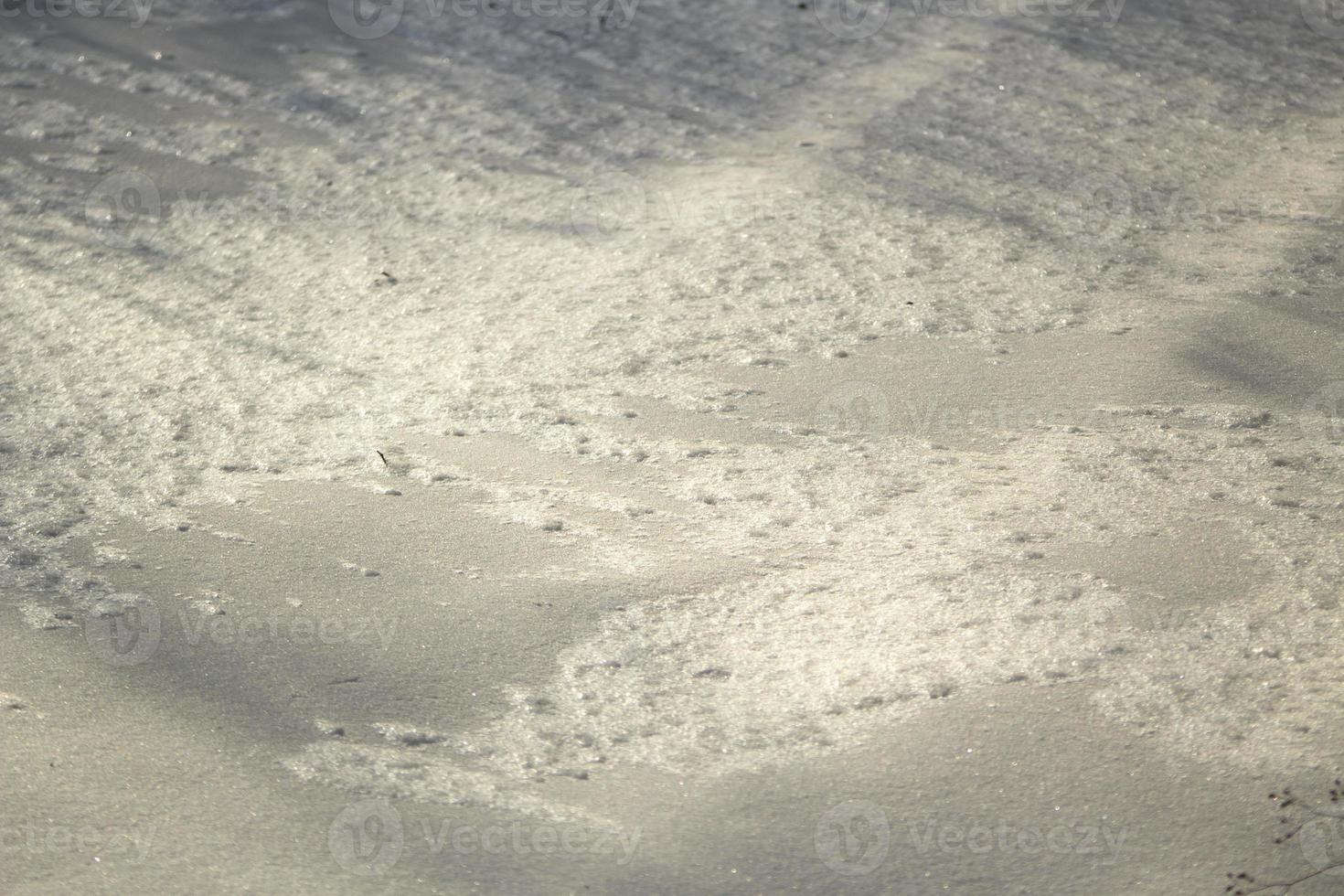 textur av snö. snö bakgrund. kall yta. foto