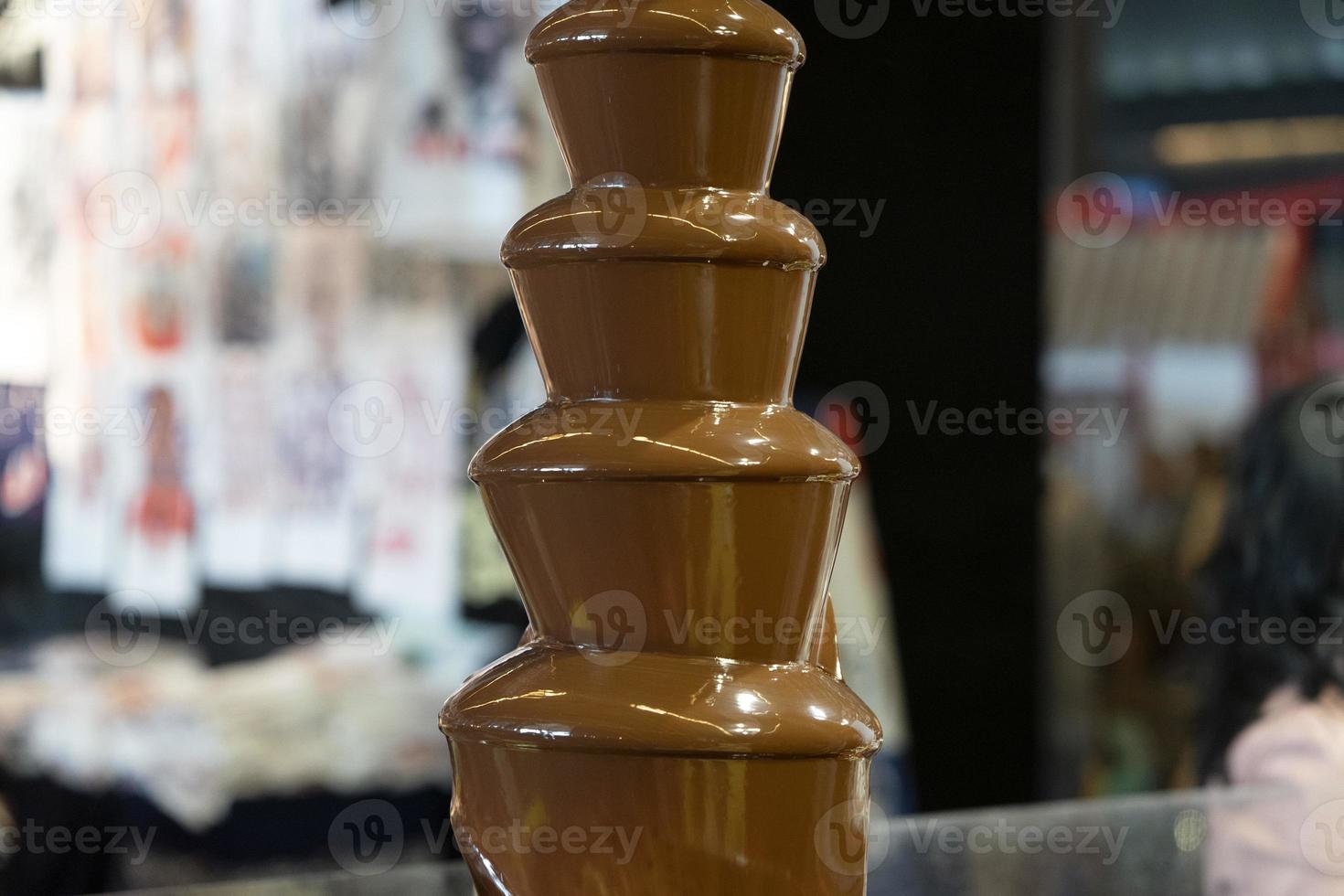 choklad fontän stänga upp foto