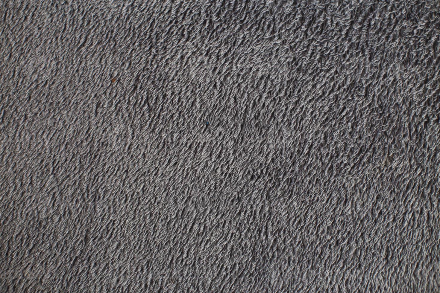 grå plysch tyg bakgrund textur, mjuk material mönster foto
