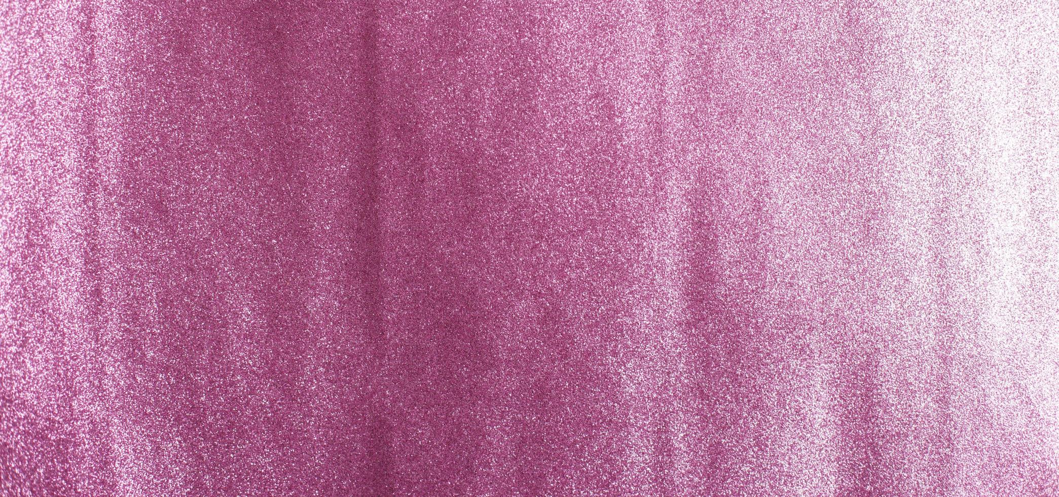 glittrande lila bakgrund av paljetter närbild. gnistra festlig veri peri textur foto