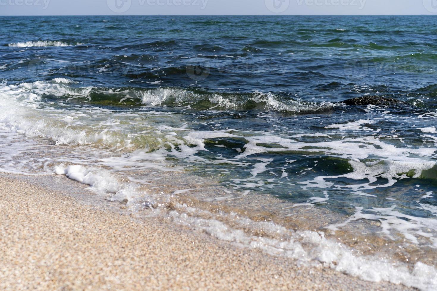 skön Foto av en strand med hav Vinka