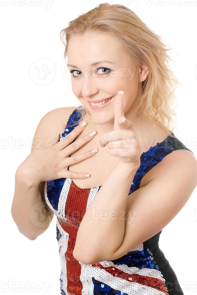 glad blond som visar henne pekfinger foto